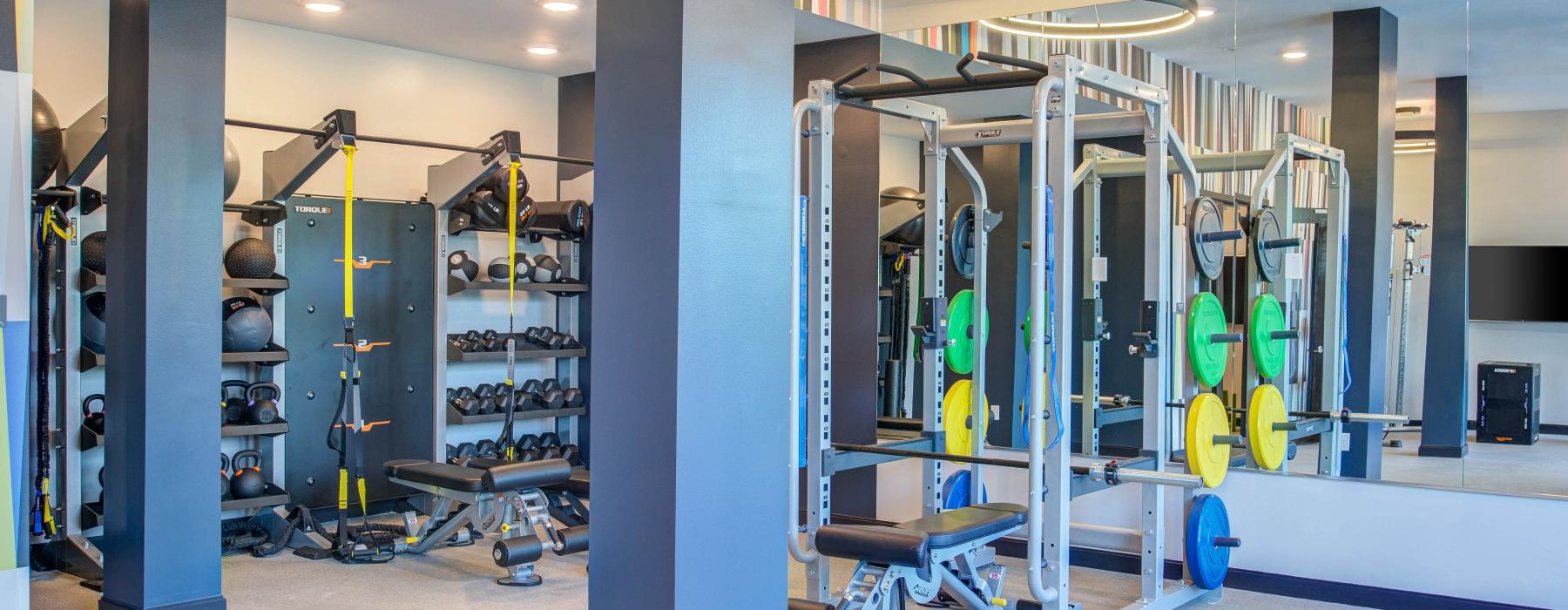 a large room with weight lifting machines