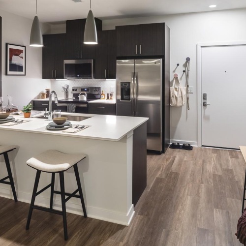 a kitchen with a table and chairs