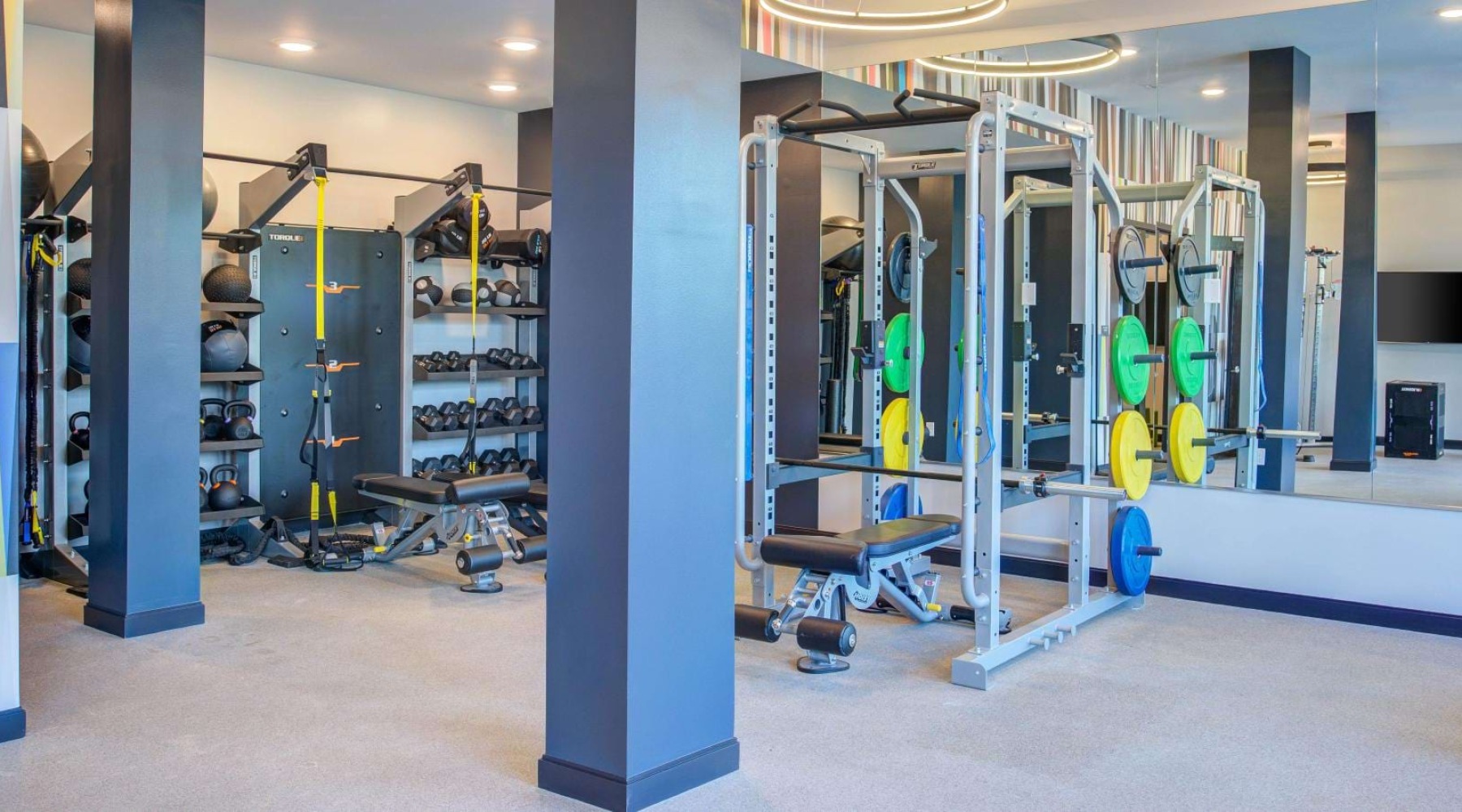 a large room with weight lifting machines