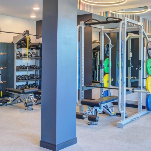 a large room with weight lifting machines