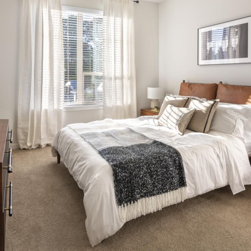 a bedroom with a bed and desk