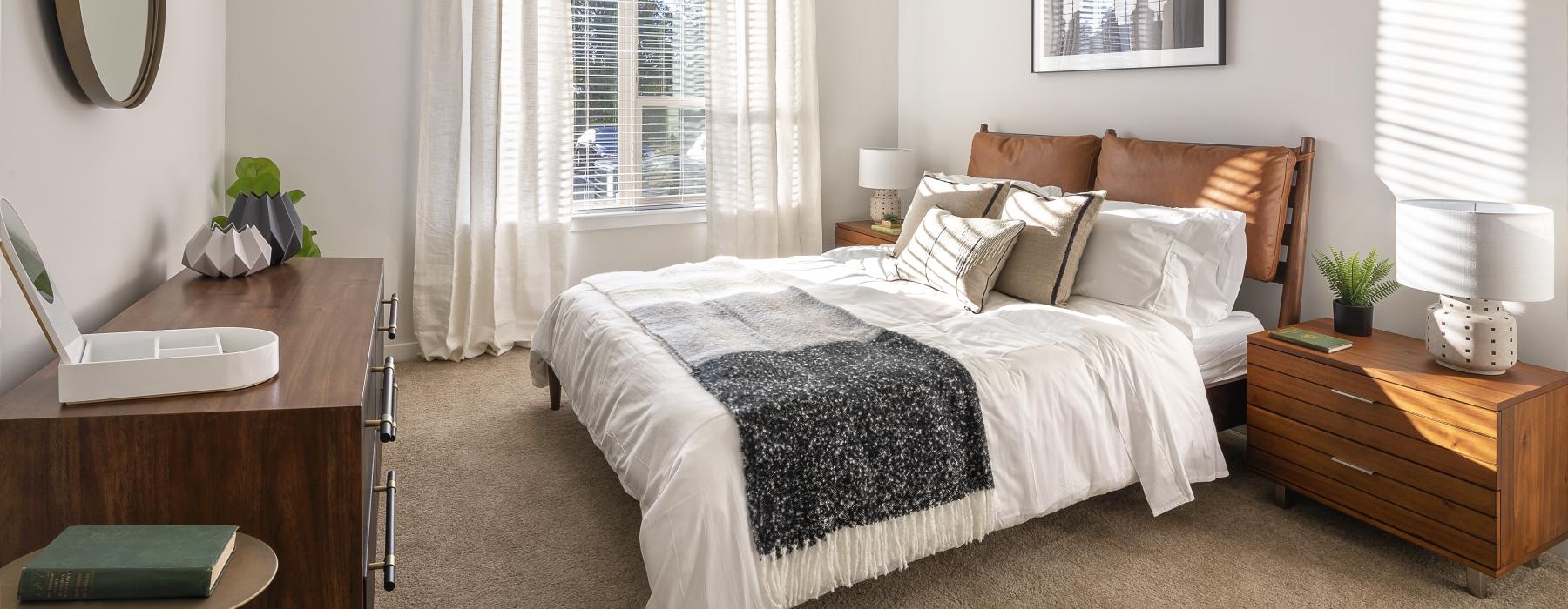 a bedroom with a bed and desk